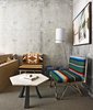 Modern home with Living Room, Chair, Coffee Tables, and Floor Lighting. Guestrooms at the Line hotel all include uniquely crafted furniture pieces by Knibb Design, such as these Negril chairs and Bianco table.
A Montego Bay, Jamaica, native, Sean Knibb creatively blends natural and man-made elements in to his designs. His company’s mantra is “creative, human, experience,” all of which are visible in the interior and exterior of the Line hotel. Knibb studied at the award-winning design school Otis Parsons School of the Arts, known for its focus in environmental design. Photo of Modernist Building in Los Angeles' Koreatown is Redesigned as The Line Hotel