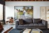 Modern home with Living Room, Sofa, Coffee Tables, Chair, and Concrete Floor. In the living area, a Ligne Roset sofa accompanies a vintage Adolf Loos coffee table. The 2003 photograph Pond Garden is by Stephen Waddell. Photo of Modern Spaces in the Pacific Northwest