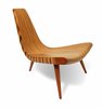 Modern home with Living Room and Chair. The 1947 three-legged chair by Joaquim Tenreiro, who was born in Portugal, was produced by Tenreiro Móveis e Decorações, Brazil. Photo of Brazilian Design 101