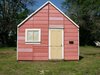Open House is located at 202 Main street in York, Alabama, between the city's post office and grocery store. The exterior reveals little of the 100-seat theater contained within. Photo of Watch an Unassuming House Unfold into a Community Theater modern home