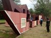 It takes four people two hours to unfold the structure. Photo of Watch an Unassuming House Unfold into a Community Theater modern home