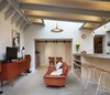 A folding screen separates a new sitting area, just off the kitchen, from the rest of the house. Photo of A Modern Addition Gives a London Chef a Dream Kitchen modern home