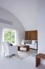 Lassen says the biggest key for designing a small space is to keep things as minimalist as possible. “Don’t try to make anything bigger or build an addition. Just remove all bad architecture and create clean, simple rooms.” Photo of A Thatched Cottage in Denmark with a Modern, Space-Saving Interior modern home