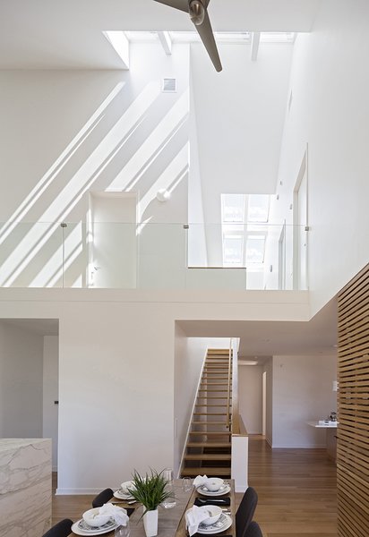 Motorized skylights by Velux, 14 in all, welcome natural light into the house.