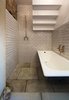 Modern home with Bath Room and Concrete Floor. In the bathroom beneath the stairs, copper fixtures and subway tile feel at once sensitive to the home's roots and very of the moment. It is this attention to cohesiveness that the Don't Move Improve! award seeks to recognize. Photo of An Award-Winning London Addition Balances New and Old