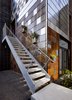 Modern home with Exterior and House Building Type. Metal shingles cut from scraps of sheet metal mix with new material as well as odds and ends, such as a road sign Baker bought at the Alameda Flea market. Baker designed stainless steel clips that allow any tile to be easily moved or replaced without the use of tools. Planter box panels add functionality to the facade and can be swapped out or relocated throughout the year. Photo of This Net-Zero Residence Might Be the Greenest Home in San Francisco