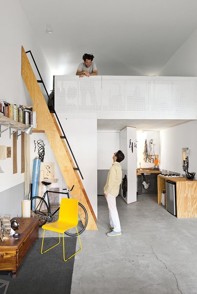 From the mezzanine of his 450-square-foot apartment at La Esquina, an eight-unit live/work building in San Diego’s Barrio Logan neighborhood, designer, artist, and Woodbury University professor Patrick Shields chats with fellow professor Hector Perez, who spearheaded the project.