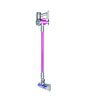 An exterior switch pops the bottom of the bin open to let out the debris. It holds 0.12 gallons, or just under 16 ounces, of waste. Photo of Dyson Wireless Handheld Vacuum for Small Jobs modern home