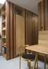 “We wanted a house that was warm and intimate, and this meant carefully considering materials and finishes,” says Thomson. “We have chosen a limited pallet of quality, robust, and tactile materials that provide a consistent theme throughout the house.” Western red cedar was used for internal cladding, built-ins, and seating. Photo 4 of Islington Residence modern home