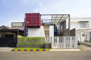 Atelier Riri devised a creative way to make living inside a shipping container in Indonesia’s tropical climate both comfortable and economical. The architects layered recycled pine, glass wool, and planter mesh on top of the home to help keep temperatures down.