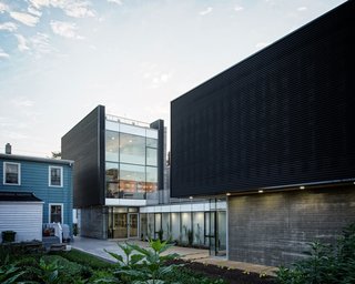 Challenged by the dimensions of the narrow lot, the team worked through significant programmatic and logistical constraints during the design and construction process. The final concept for the layout was a modern take on the side hall plan. The living spaces are stretched back deep into the lot, and strategically raised above grade to allow sunlight to penetrate into multiple living spaces. The multifunctional courtyard serves as outdoor workspace, gardening area, children's play area, and covered parking during winter months.