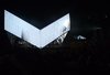 By nighttime, the pavilion facade acts as both a canvas and a glowing light source, apt for a performance or a film projection installation. Photo of A Modular, Translucent Pavilion With a Fabric Facade modern home