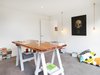 Along with the bedrooms, the home’s study features local Australian undyed wool carpets. The red cedar tabletop was repurposed from an old Queensland table that had been in Agata’s family. Brightgreen LED downlights illuminate the space. The orientation and functionality of the office is one of the couple’s favorite aspects of the home; they are able to work in a private area while keeping an eye on their son across the courtyard in the playroom. Photo 10 of 1850s Prefab Cottage from Boston Finds New Life in Australia modern home