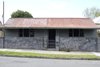 The original home is seen before the dramatic transformation. During the demolition, roof shingles were uncovered beneath the corrugated iron sheeting. It was theorized that the home could have originally been a general store, halfway house, or possibly even a brothel. Photo 11 of 1850s Prefab Cottage from Boston Finds New Life in Australia modern home