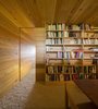 Modern home with Office, Library, and Bookcase. The library is accessed by a sliding wood door. Photo 8 of Refuge