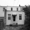 The home's rear exterior before the renovation. Photo 2 of Revitalization modern home