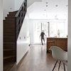 The biggest challenge of the project was designing a space that could be easily converted from a 2-family to a 1-family. Thoughtful planning and inventive storage systems were thus key to the success of the renovation. Photo 3 of Revitalization modern home