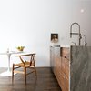Earthy details meet minimalist angularity in the kitchen. Consentino countertops play to both styles. Photo 5 of Revitalization modern home