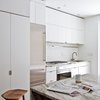 The white interior, in addition to presenting the home as a potential blank canvas, helps reflect ample natural light. Photo 6 of Revitalization modern home