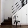 Modern home with Staircase, Wood Tread, and Metal Railing. “Elegant material choices, subtle detailing, and thoughtful spatial sensibilities belie the building’s intelligent space planning,” says Aniket Shahane of OA. Photo 7 of Revitalization
