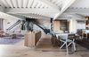 In the new 2,770-square-foot apartment, original I-beams brace the structure at dramatic angles and collide overhead, and the raw concrete is tempered by blackened steel, white-oak flooring, and bush-hammered Carrara marble—all selected by Willis. Photo 2 of Parker Willis House modern home