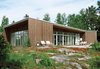 Modern home with Exterior, Prefab Building Type, Wood Siding Material, and Flat RoofLine. Multi-disciplinary Swedish firm Claesson Koivisto Rune created the plans for this home for design-minded kit-house manufacturer Arkitektus. Considering the unique balance of the facade, as well as its climate-specific construction—the asymmetrical "lifted" roof allows for both water drainage and maximum light during the dark winter months—Claesson Koivisto Rune’s approach to the project is somewhat surprising. "We design buildings from the inside out," explains principal Eero Koivisto. "The exterior is more or less a product of the interior plans." Photo of Sourcing Guide for Modern Prefab Companies in Europe