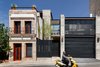 The early-20th-century structure is seen next to the 300 square meter modern addition. A garage and patio were added, as well as a balcony that would complement the proportions of those in the original building. According to Quevedo, the biggest challenge was to approach both structures with a “common language” and explore the idea that “preservation and modernity can coexist.” Photo of Hybrid Home modern home