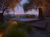 Three olive trees currently anchor the hot tub and deck area. The architects explain that transplanting them with a crane essentially positioned on a cliff face was one of the biggest challenges of the project. Photo of A Spa-Like Patio with Stunning Views Cascades Down a Los Angeles Hillside modern home
