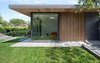 Modern home with Outdoor, Grass, Small Patio, Porch, Deck, and Pavers Patio, Porch, Deck. “Before, the house turned its back on the landscape,” said Parish. “This renovation and addition really animates the garden.” Sliding glass doors match those of the living room beyond the deck, and both can be completely open to the yard. Photo 18 of Trotman Residence