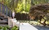 Modern home with Outdoor, Walkways, Front Yard, and Trees. The backyard’s emphasis on nature is mirrored in the front of the home, which also underwent extensive landscaping by Considered Design. The owners and Parish wanted to “tone everything down” and turn the home into a backdrop for a natural setting. Photo of Modern Spaces in the Pacific Northwest