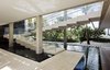 Arranged to appear to be a series of solid blocks, the floating staircase took six months to build. It is made of shell-reef slabs. Photo 2 of Casa Bahia modern home