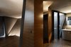 A complex spatial plan gives dimension to an otherwise traditional two story home. TOTO and CERA fixtures liven up the downstairs bathroom. Photo 7 of SRK modern home