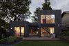 Modern home with Exterior, Flat RoofLine, House Building Type, and Wood Siding Material. “Initially the design had the studios completely separated from the main house with a sort of breezeway in between,” says Stern, who ultimately decided to physically connect them in a way that evokes walking through the outdoors. “The studios and breezeway are separated from the main house with pocket doors to create privacy when needed, and allow it to function as a separate guest suite for overnight visitors.” Photo of A Green Portland Home Built to Passive House Standards