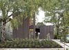 Modern home with Exterior, House, Flat RoofLine, and Wood Siding Material. While the home’s simple, boxy forms starkly contrast with surrounding residences, its compact shape and modest scale help it fit into the traditional neighborhood without calling attention to itself. The house was built around a large birch tree, with dwarf fountain grass and porcupine grass planted in front. A weeping blue atlas cedar provides a focal point near the front door. Photo of Super-Insulated Houses That Stand Up to Winter's Chill