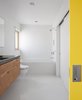 Modern home with Bath Room and Wall Mount Sink. In the bathroom, plywood cabinets by Doug Chamblin support a concrete countertop Stern designed himself. A Toto toilet, Americh tub, Duravit sink, and Danze Parma faucet round out the space. Photo of A Green Portland Home Built to Passive House Standards