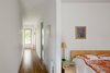 Modern home with Bedroom, Bed, Table Lighting, and Night Stands. Using scrap material from the kitchen cabinets and island, Stern and Chamblin created custom bedside tables that support a lamp by Seattle designer Brent Markee. Photo of A Green Portland Home Built to Passive House Standards