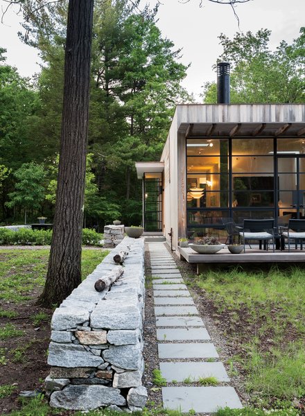 Outside, Sultan added a stone wall to anchor and extend the structure into the landscape.