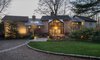 The ultimate retreat, this mid-century modern masterpiece features a main house, separate guest house and three-car garage. Luxurious mahogany finishes can be found throughout the interior of the home in addition to dramatic main rooms and a gourmet kitchen built by Boffi in Italy. Photo of Unforgettable Midcentury Homes by Modern Masters modern home