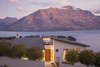 With design aesthetics akin to the mid-century modern movement in the united states, this exceptional home is perched atop the iconic Queenstown Hill and boasts incredible views. Complete with meticulously manicured grounds, five spacious bedrooms and a fully equipped modern kitchen, this residence is quintessential Queenstown living. Photo of Unforgettable Midcentury Homes by Modern Masters modern home