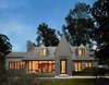 Designed by renowned Washington architect Robert Gurney, this home is a modern interpretation of historical revivalism. It spans over 8,000 square-feet and includes six bedrooms and five and a half bathrooms. Photo of Unforgettable Midcentury Homes by Modern Masters modern home