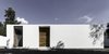Both the white facades and modules' orientations are crucial in maintaining comfortable indoor temperatures. Designed with the sun path in mind, each part of the home shades the courtyard year-round for residents. Photo of A Minimalist Mexican Retreat that Uses an Array of Strategies to Beat the Heat modern home