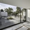 The interior marble flooring and exterior granite surfacing blend well to complement the spare white modules. Both materials were chosen with climate in mind: granite because it both absorbs less heat and is easy to clean, marble because it cools down the interior. Photo of A Minimalist Mexican Retreat that Uses an Array of Strategies to Beat the Heat modern home