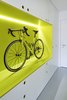 The owner is an avid cyclist; the guest apartment's hallway entrance features this unique storage space for his roadbike. Old damaged floors were replaced with a durable polyurethane coating. Photo 3 of Strikingly Minimal modern home