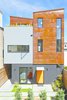 “We are always interested in doing unapologetic modern design in an architecturally conservative city,” Zack says. The front unit’s door to the courtyard is painted in Sherwin-Williams’ “carnival” shade. Photo of A San Francisco Renovation Creates Two Apartments from One modern home