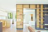 “I came up with an idea of making steel parts with ‘mortise and tenon’ joints, used in woodwork, to make it easy to fit parts together,” Zack says. Custom shelves in the rear unit were made with plywood parts by Dawson Wood Interiors and steel from the firm, Zack | de Vito Architecture + Construction. Photo of A San Francisco Renovation Creates Two Apartments from One modern home