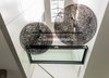 “The atrium stair connects all spaces vertically, and links the front and back of each floor level horizontally,” says Walker. Random Lights by Moooi hang across from the glass bridge under the atrium. Photo 3 of Back Bay modern home