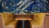 The mural was designed and painted by Melissa Terrezza, and Peter White constructed the booths. Photo of A Restaurant Constructed from 19 Salvaged Shipping Containers modern home