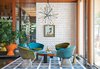Modern home with Living Room, Chair, and Pendant Lighting. “There’s no right answer except to play and experiment,” says interior designer Jonathan Adler in regards to the Shelter Island getaway he shares with his husband, fellow design expert Simon Doonan. Custom ceramic wall tiles, a few plants, and a self-made rug, stool, and coffee table all add to the home's inimitable decor. Photo of 50+ Modern Tile Ideas for Walls, Floors and Ceilings