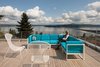 In keeping with the rest of the home, the deck was built from cedar. The tight-knot, 5/4-inch by 4-inch planks are enclosed by a steel guardrail. Photo 9 of Cedar Douglas Residence modern home