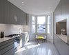 Modern home with Kitchen, Wood Cabinet, and Light Hardwood Floor. Throughout the home, the original strip-wood floorboards were preserved and painted a soft, muted gray. The cool tones of the kitchen are punctuated by a bright yellow children's table by the bay window. Photo of A Compact, Light-Filled Victorian Renovation in England